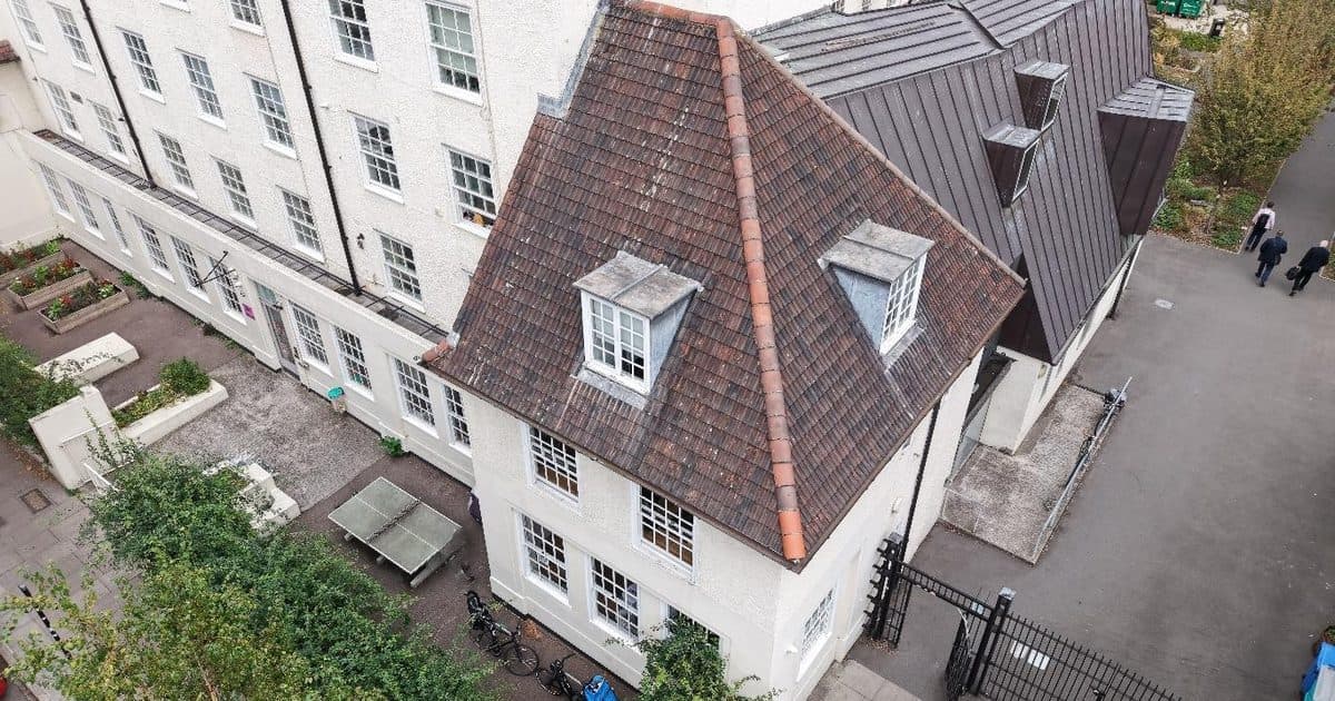 Drone view of the clay tiled tower roof and lead dormers on a Georgian youth charity building in King's Cross