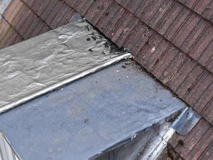 Flashband and liquid roof coating applied as a temporary repair to a lead dormer roof